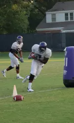 T.J. Lee works through a drill during ECU's first full-pad practice Tuesday.