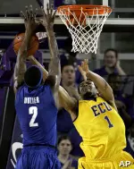 Darrius Morrow tries to shoot past Memphis' Robert Dozier during the first half. (AP Photo/Gerry Broome)