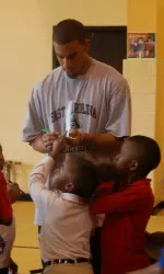 Jamar Abrams signs autographs at the Boy's and Girl's Club.
