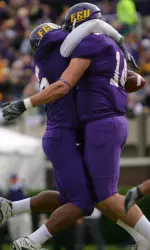 Kevin Gidrey (left) celebrates with Rob Kass after Kass' first career touchdown reception.