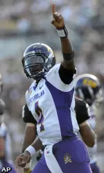East Carolina quarterback Dominique Davis (4) celebrates after scoring on a 10-yard rushing touchdown during the first half.