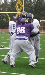 Freshman Jimmy Booth makes a tackle during a drill early in Sunday's practice.