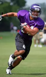 Freshman inside wide receiver Gray Mazzone runs after making a catch during practice.