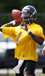 Dominique Davis throws a pass during the first practice of the 2010 season.