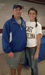 Casey Alcorn, standing with her father and high school softball coach, Steve, will play softball for the Pirates starting in the fall of 2012.