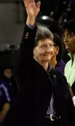 Alice Keene, who also served as an honorary coach, waves to the crowd Sunday.