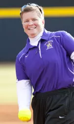 Head coach Tracey Kee throws out one of the ceremonial first pitches as the Pirates opened the ECU Softball Stadium Wednesday against UNC Wilmington.
