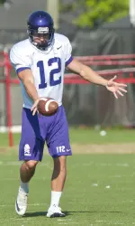 Ben Ryan gets ready to punt a ball during East Carolina's practice.