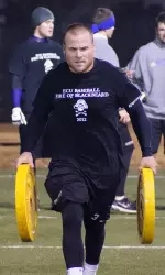 Senior Sam King completes in the Farmer's Walk during the 2012 Fire of Blackbeard Challenge.