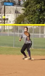 Junior Cicely Lopez waits for a throw at first base while at practice at her high school Friday afternoon.