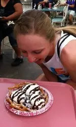 Sophomore Alex Fieldhouse, who led all players at the DeMarini Invitational with a .615 batting average, gets ready to gobble down a funnel cake Monday afternoon at Disneyland.