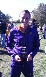 Brooke Kott holding her First-Team All-Conference USA plaque