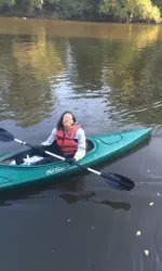 Abria Trice helping clean up Tar River