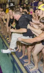 Rick Kobe gets tossed into the pool after recording his 500th win