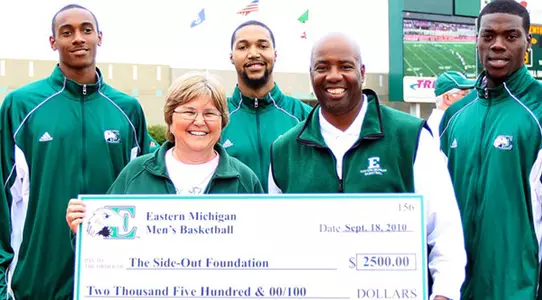 Men's Basketball Donates $2,500 to EMU's "Dig Pink" Effort