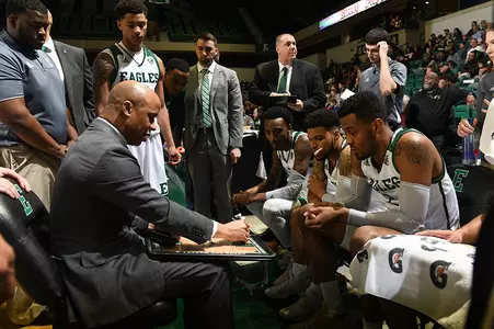 Rob Murphy and team huddle