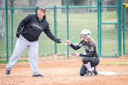 Alex Peters gets a treat on third with Melissa Gentile