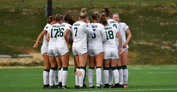 Soccer group huddle vs. Toledo