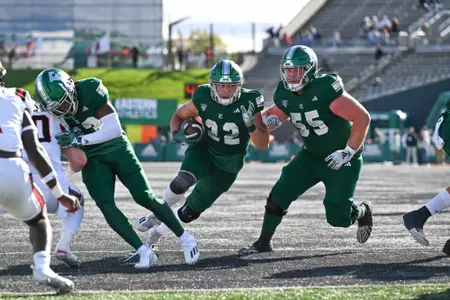 Samson Evans carries the ball for two-yards into the end zone for his school-record 32nd career touchdown.