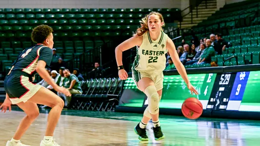 Cali Denson drives to the basket in her collegiate debut against Detroit Mercy