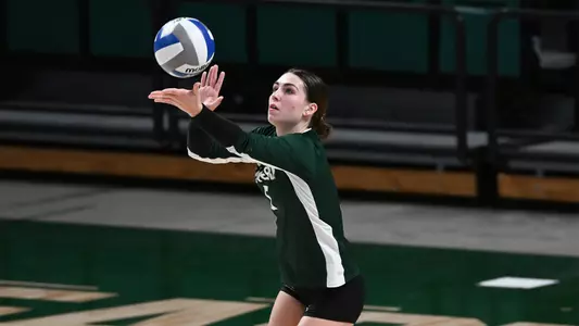 Emma McMahon getting ready to serve the ball