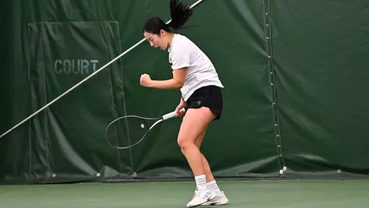 Wanyi Zhang of the EMU Tennis team celebrates a win in a match against Western Michigan