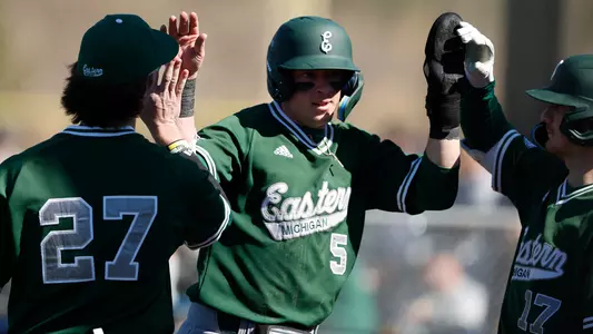 Glenn Miller celebrates after scoring a run vs. NKU