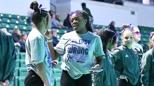 Ari Harris talking to Alana Fisher during Kent State meet