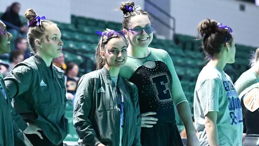 Gianna Antonio and Cassie Bergin watching floor against Kent State