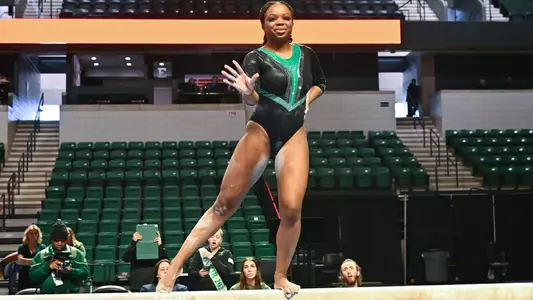 Ari Harris performing beam exhibition on Senior Day (3)
