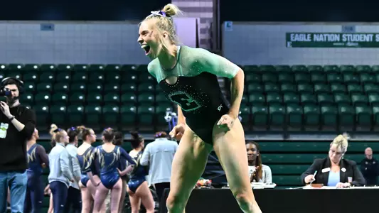 AG McCullough celebrates after Kent State meet floor routine