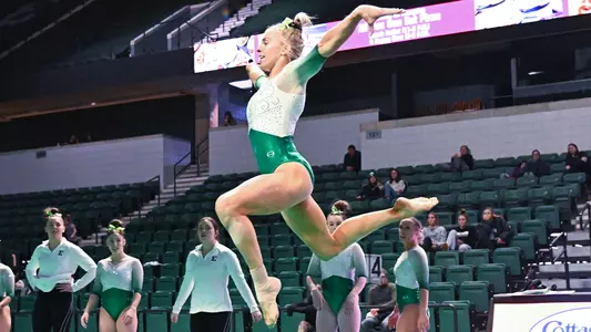 AG McCullough jumps during floor routine against Ball State