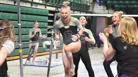 AG McCullough celebrates bar routine against Kent State