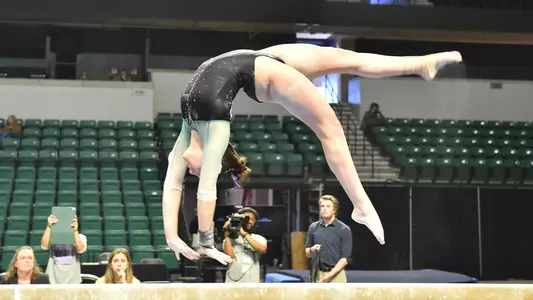 Cassie Bergin in her series on beam against Kent State