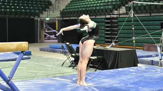 Cassie Bergin sticks her beam landing against Kent State