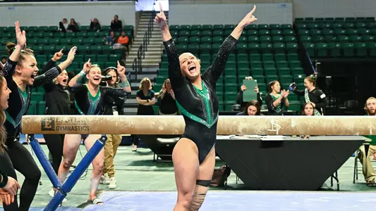 Mick Stuckey sticks her beam landing against BGSU