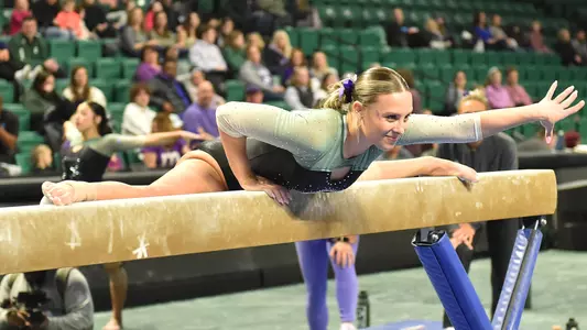 Mick Stuckey mounts beam against Kent State