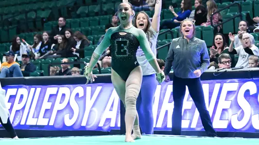 Mick Stuckey celebrates landing tumbling pass on floor against Kent State