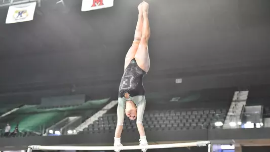 Trinity Macy handstand on bars against Kent State