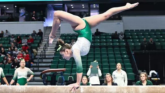Ella Chemotti performs a handstand on beam against Ball State