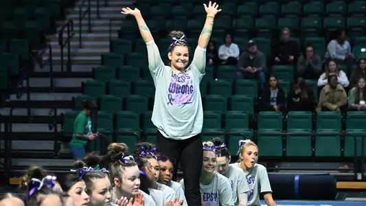 Hay Crossen waves to crowd after Kent State meet