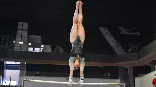 Hay Crossen performs handstand on bars against Kent State
