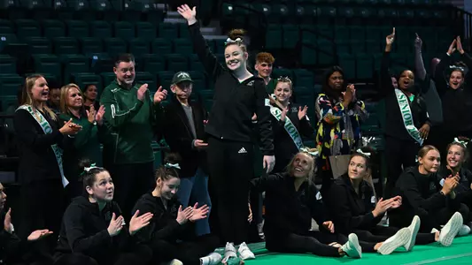 Rai Boris waves at crowd after taking the floor title against BGSU