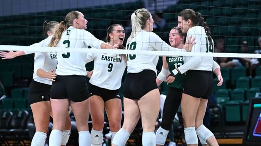 Volleyball Team celebrating against CMU