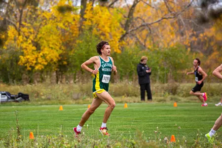 Marcus Kemp runs at the 2023 MAC Cross Country Championships