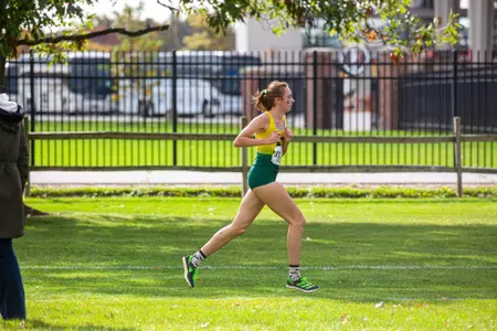 Chloie Musta runs at the 2023 MAC Cross Country Championships
