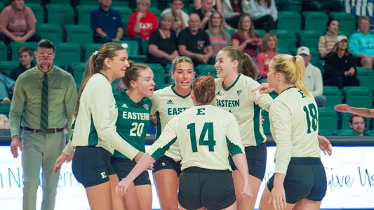 Volleyball celebrates a point against Miami, Oct. 5