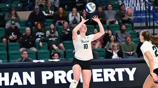 Maddie Stayer sets a ball against Akron, Nov. 9, 2024