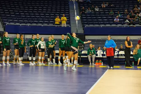 Lauren Welch serves vs Michigan