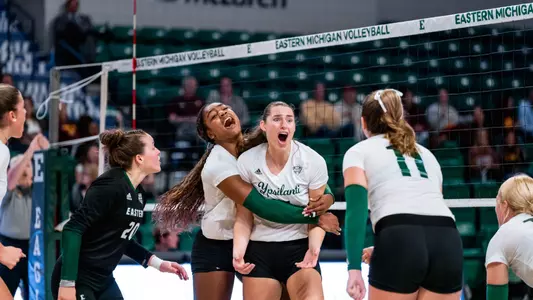 Kaili Doctor and Abby Stanford celebrate a point against Central Michigan, Nov. 5, 2024